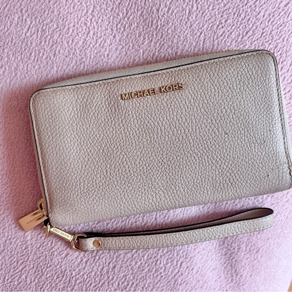 beige Michael Kors wallet with hand strap - Picture 1 of 2